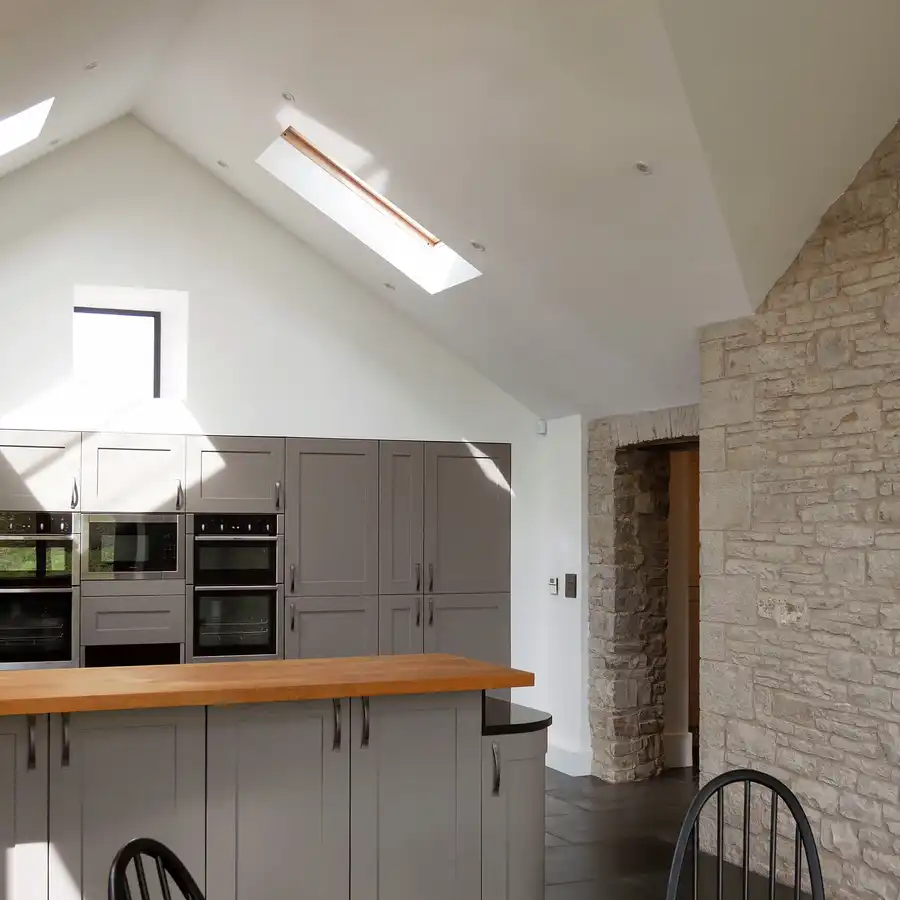 Sunlit kitchen interior with satellite windows