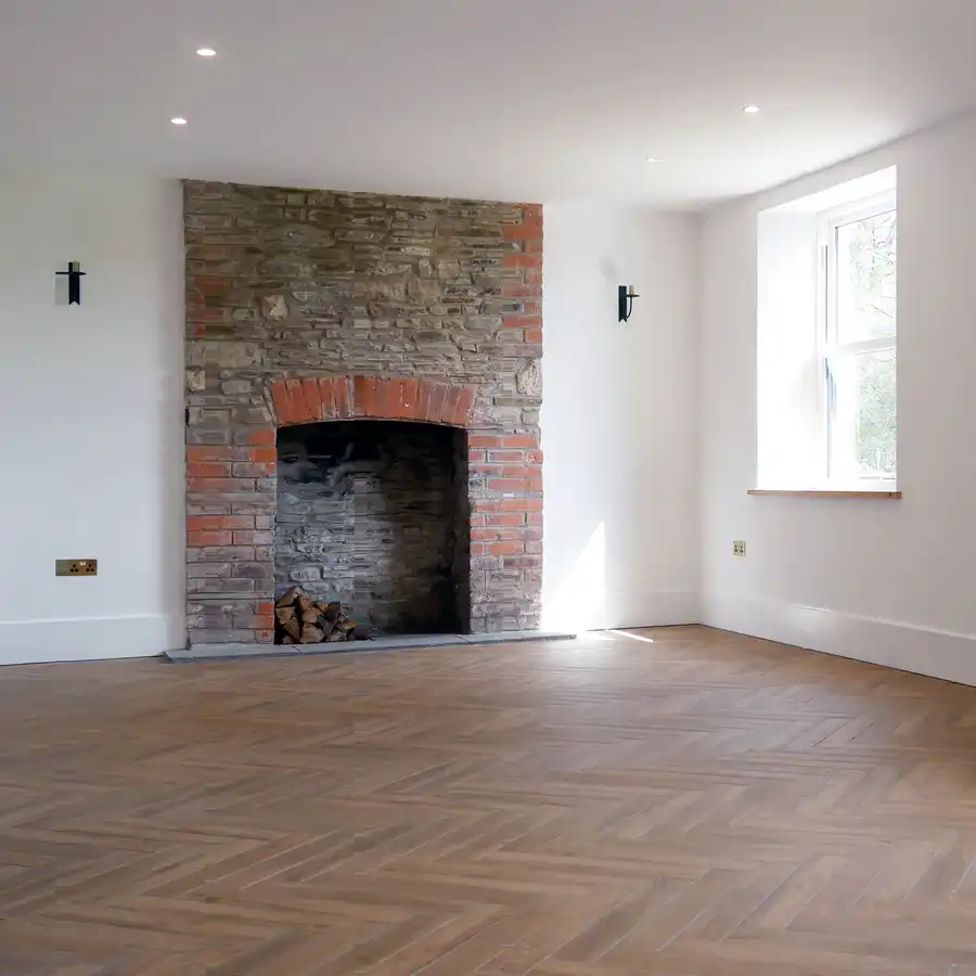 Wide shot of empty, undecorated farm house living room
