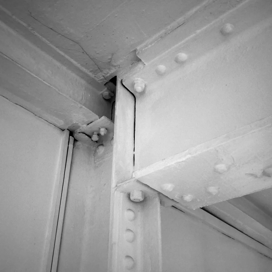 Close up of a riveted steel strut