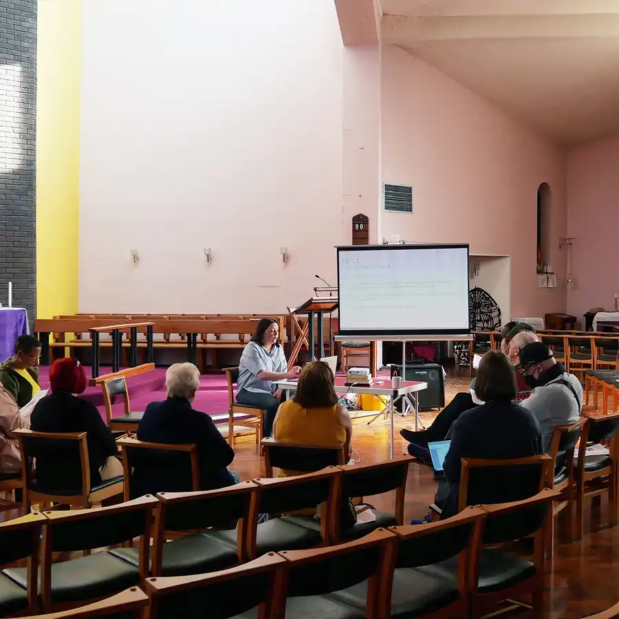 Meeting in a church with whiteboard presentation