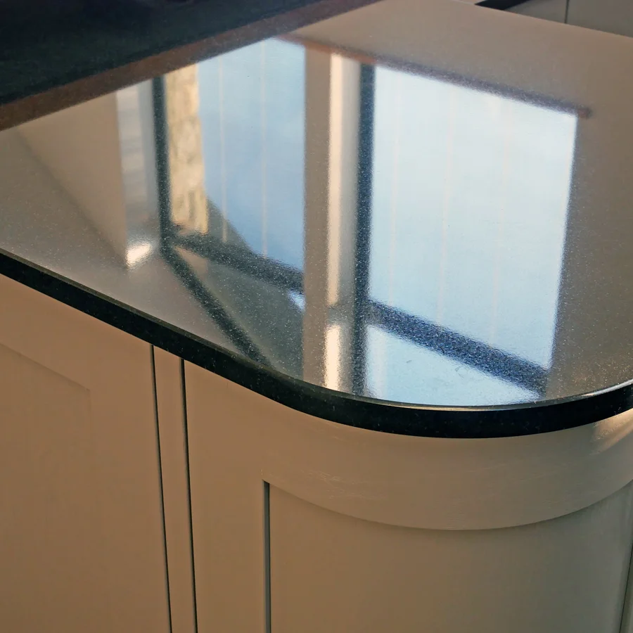 Close up of marble worktop reflecing window light from above